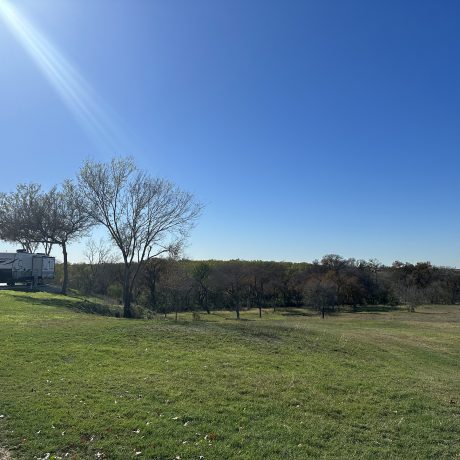 view of RV sites on paved platforms with a picnic table at Hidden Valley RV Park