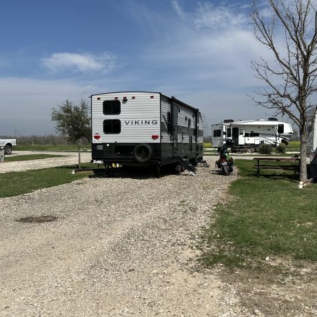 Viking travel trailer in a gravel pull thru rv site at Hidden Valley RV park